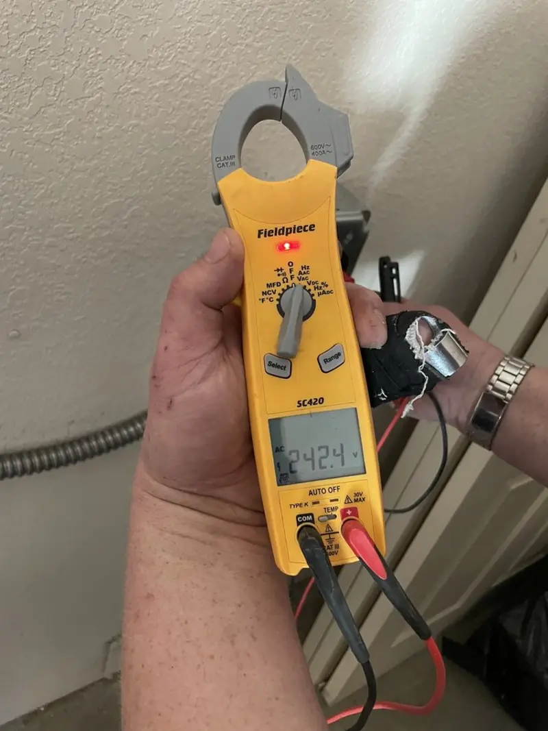 Voltage testing with clamp meter during Whole House Surge Protector in Lenexa